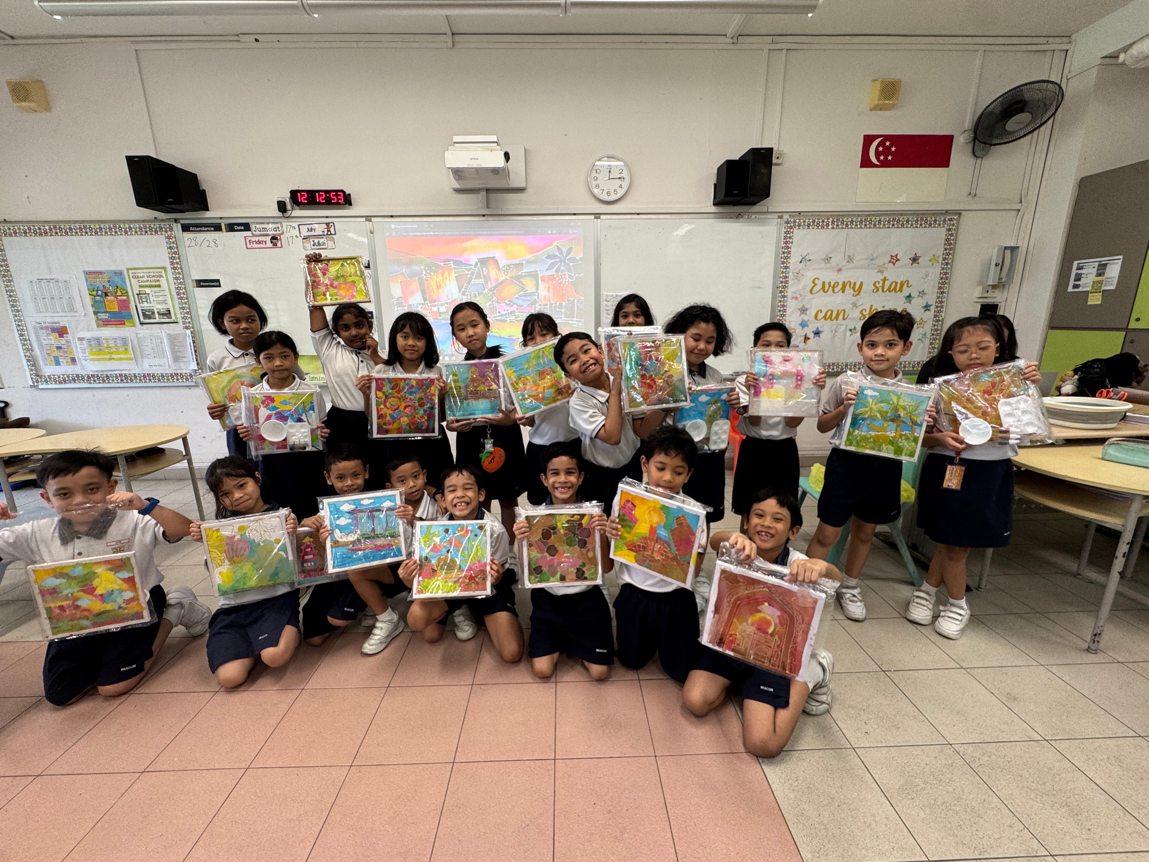 P2 ML Students proudly showcasing their completed batik artwork inspired by traditional Malay culture.